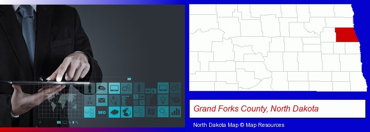 information technology concepts; Grand Forks County, North Dakota highlighted in red on a map